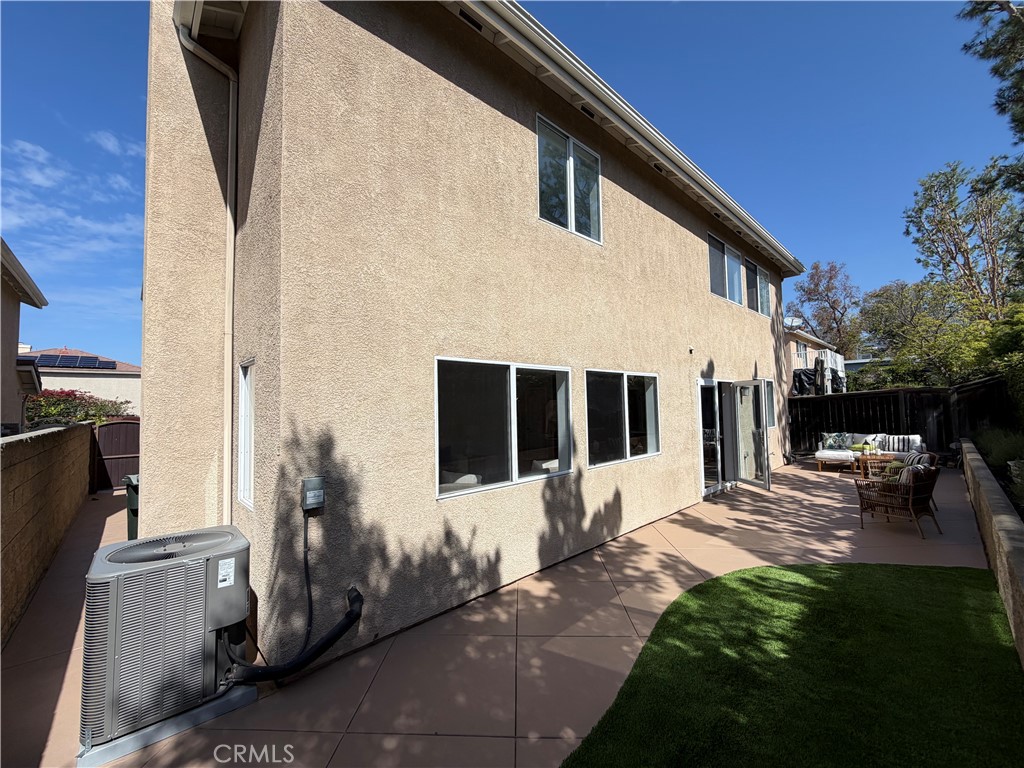 6 Hemingway Court Rancho Santa Margarita, CA 92679 - Photo 17 of 17 a view of a house with backyard and sitting area
