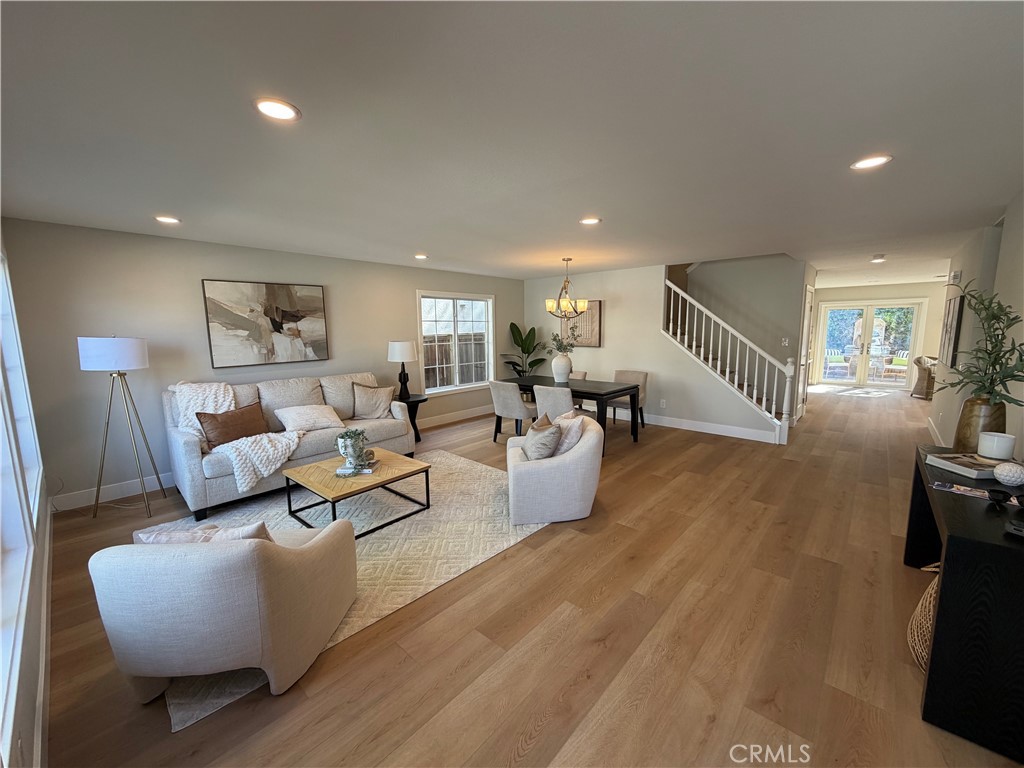 6 Hemingway Court Rancho Santa Margarita, CA 92679 - Photo 2 of 17 a living room with furniture and a wooden floor