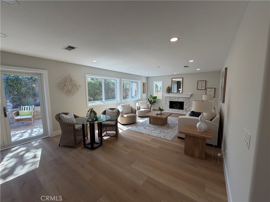 6 Hemingway Court Rancho Santa Margarita, CA 92679 - Photo 3 of 17 a living room with furniture and a large window