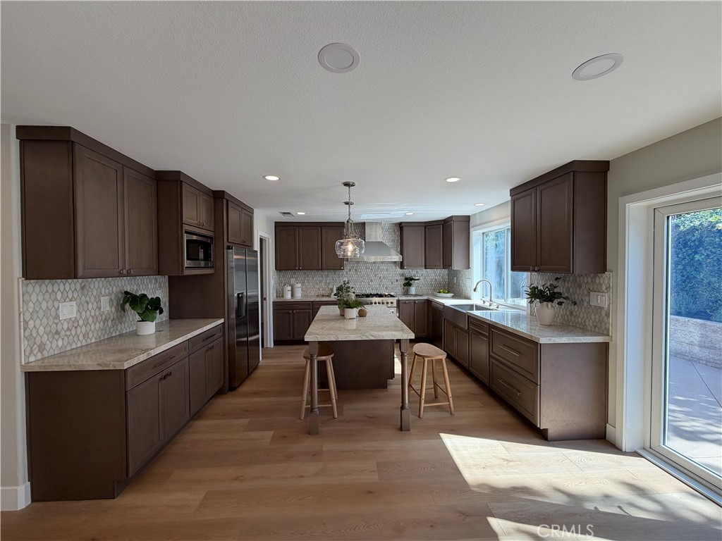 6 Hemingway Court Rancho Santa Margarita, CA 92679 - Photo 4 of 17 a large kitchen with stainless steel appliances lots of counter top space