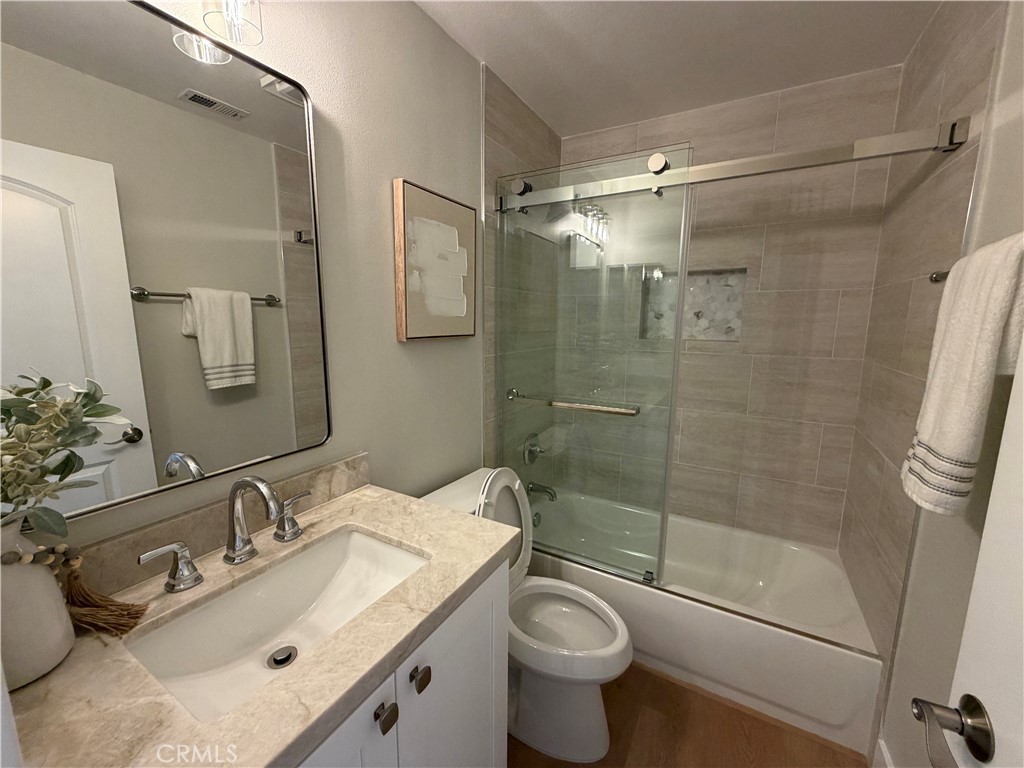 6 Hemingway Court Rancho Santa Margarita, CA 92679 - Photo 8 of 17 a bathroom with a sink toilet and shower