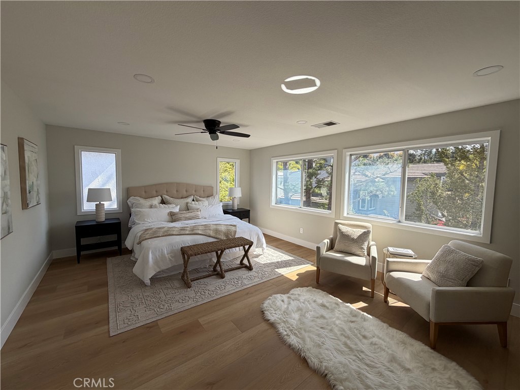 6 Hemingway Court Rancho Santa Margarita, CA 92679 - Photo 9 of 17 a bedroom with a bed and glass window