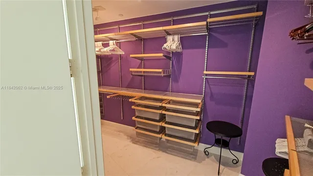 a view of room with furniture and wooden floor