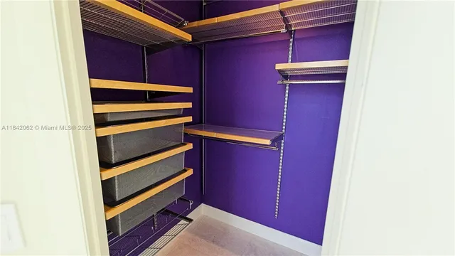 a bathroom with a glass door shower