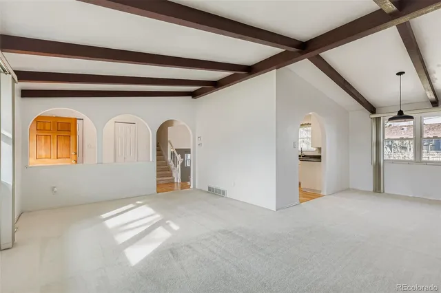 a view of a livingroom with wooden furniture