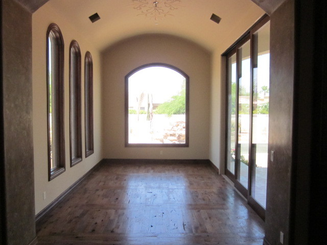 6600 East Doubletree Ranch Road Paradise Valley, AZ 85253 - Photo 11 of 42 a view of empty room with wooden floor and fan