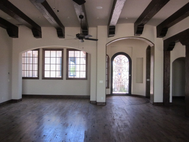 6600 East Doubletree Ranch Road Paradise Valley, AZ 85253 - Photo 17 of 42 a view of an empty room with wooden floor and a window