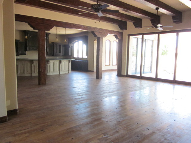 6600 East Doubletree Ranch Road Paradise Valley, AZ 85253 - Photo 18 of 42 a view of a hallway with wooden floor and a kitchen