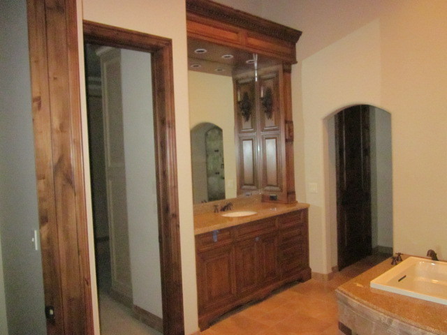 6600 East Doubletree Ranch Road Paradise Valley, AZ 85253 - Photo 32 of 42 a bathroom with a double vanity sink and a mirror