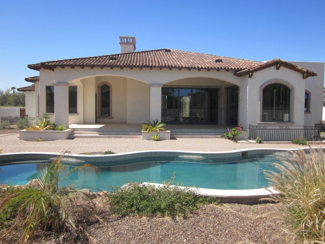 6600 East Doubletree Ranch Road Paradise Valley, AZ 85253 - Photo 39 of 42 a view of a house with swimming pool and a porch with furniture