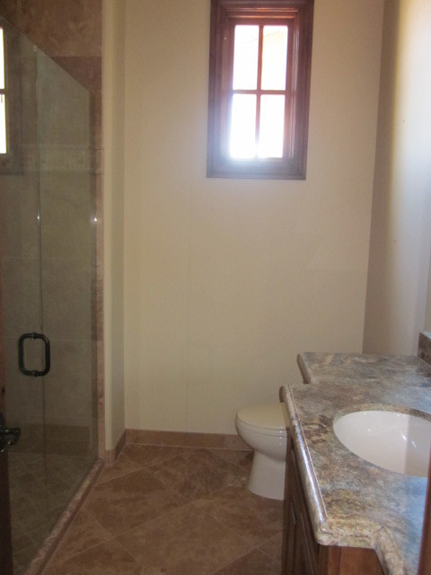 6600 East Doubletree Ranch Road Paradise Valley, AZ 85253 - Photo 8 of 42 a bathroom with a granite countertop sink a toilet and shower