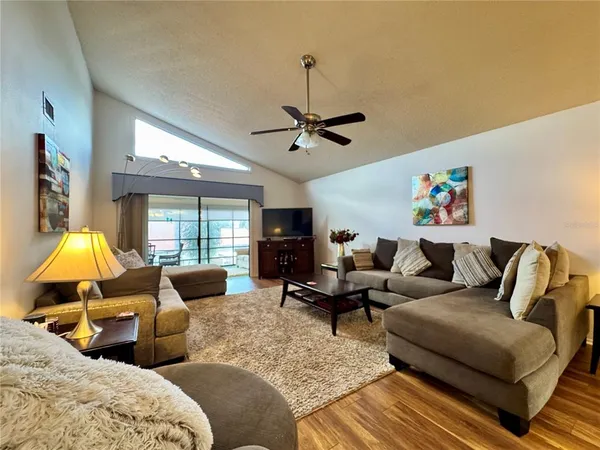a living room with furniture and a large window