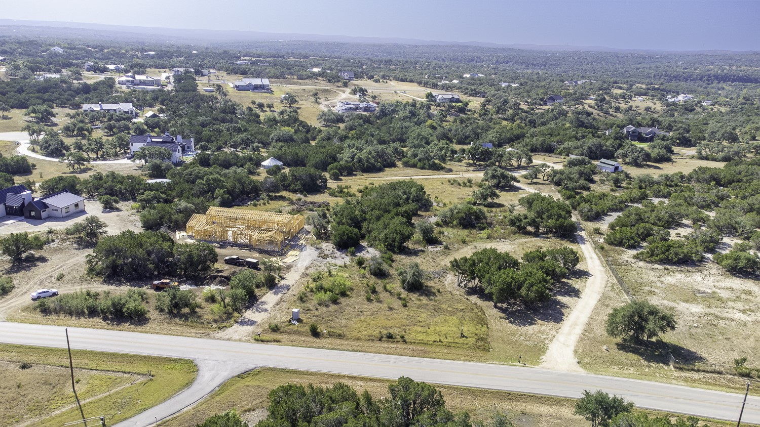 2251 West Fitzhugh Road Dripping Springs, TX 78620 - Photo 4 of 16 an aerial view of residential houses with outdoor space and trees