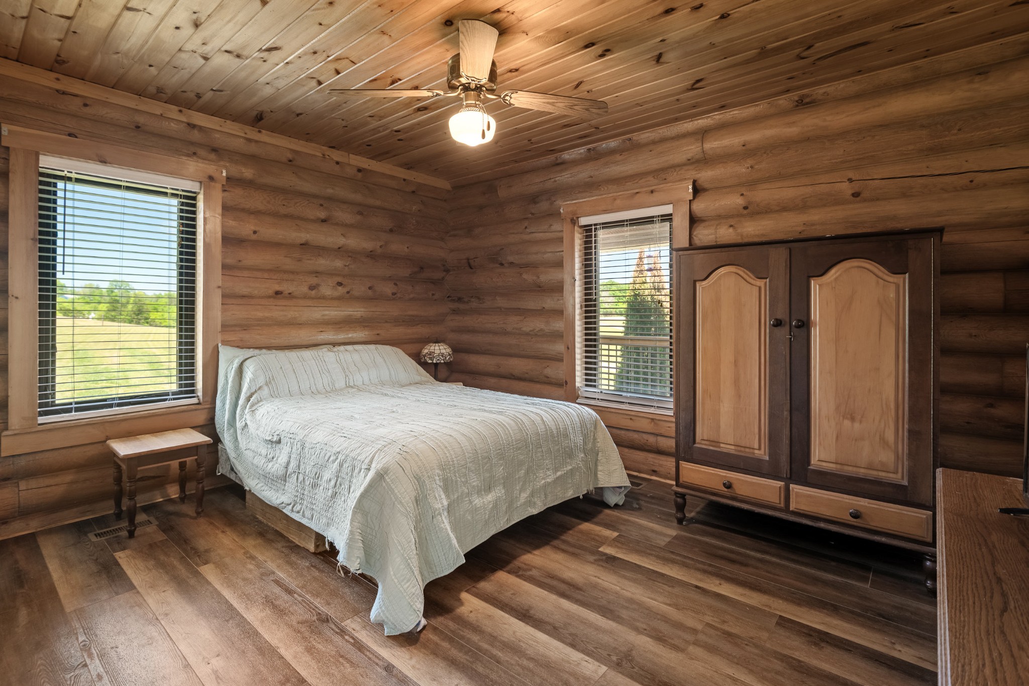 642 Beach Bottom Road Watertown, TN 37184 - Photo 19 of 48 a bed sitting in a spacious bedroom next to a window