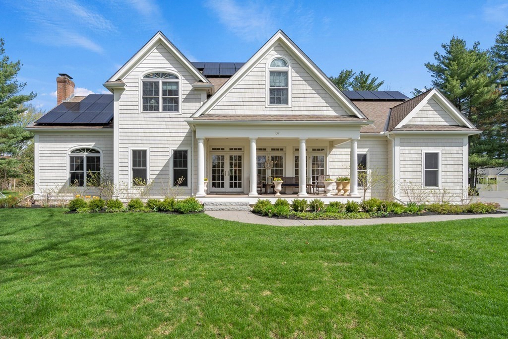 137 Randall Road Stow, MA 01775 - Photo 1 of 38 a front view of a house with a yard and porch