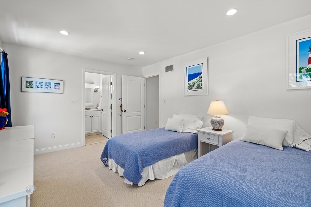 137 Randall Road Stow, MA 01775 - Photo 19 of 38 a spacious bedroom with two beds and a couch