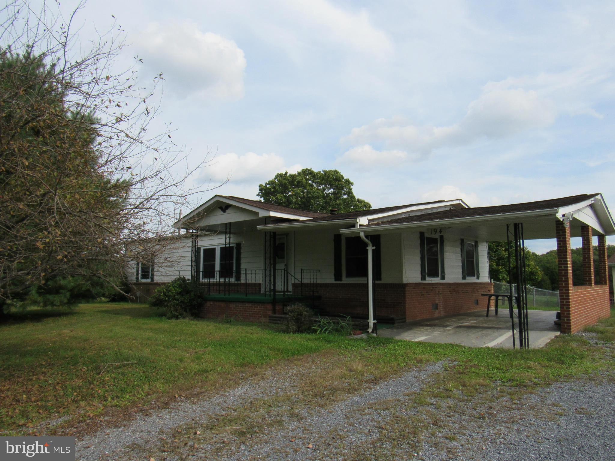 172 Rogers Mill Road Strasburg, VA 22657 - Photo 4 of 23 a view of a house with yard and a garden