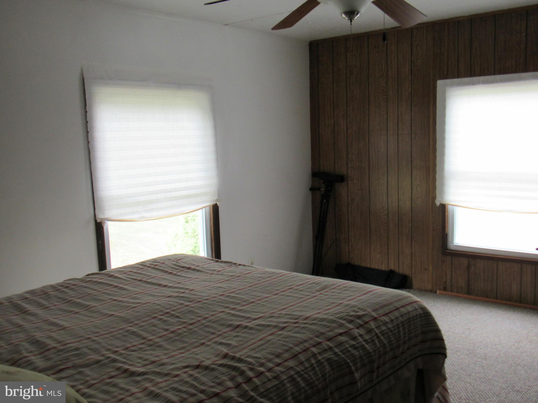172 Rogers Mill Road Strasburg, VA 22657 - Photo 10 of 23 a bedroom with a bed and a window