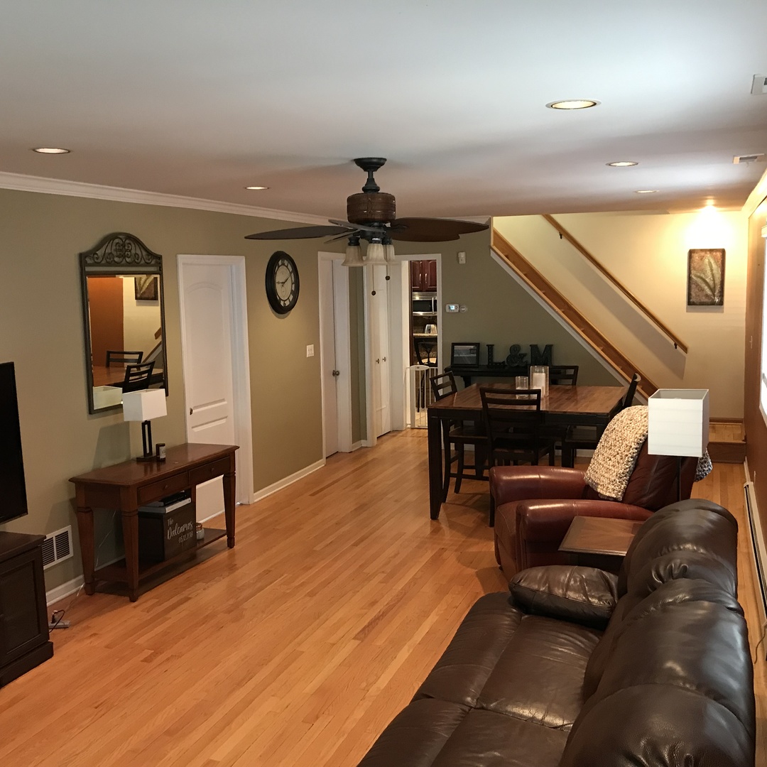 3110 South Racine Avenue Chicago, IL 60608 - Photo 6 of 23 a living room with furniture and wooden floor