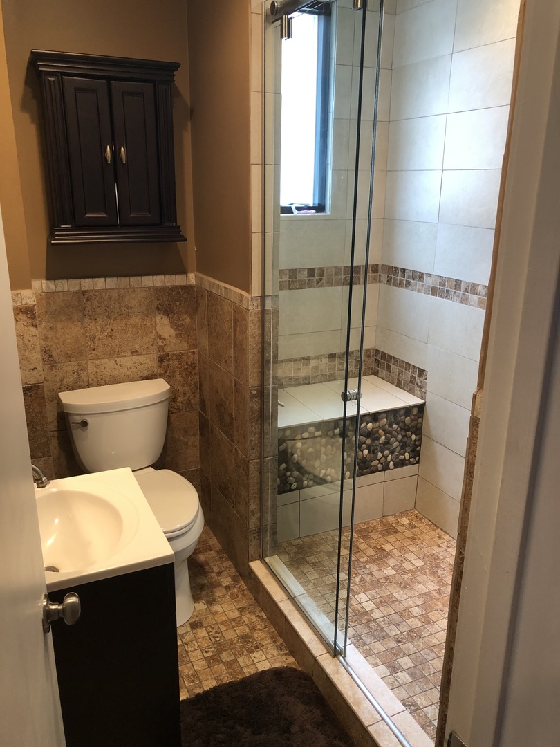 3110 South Racine Avenue Chicago, IL 60608 - Photo 7 of 23 a bathroom with a toilet and a shower