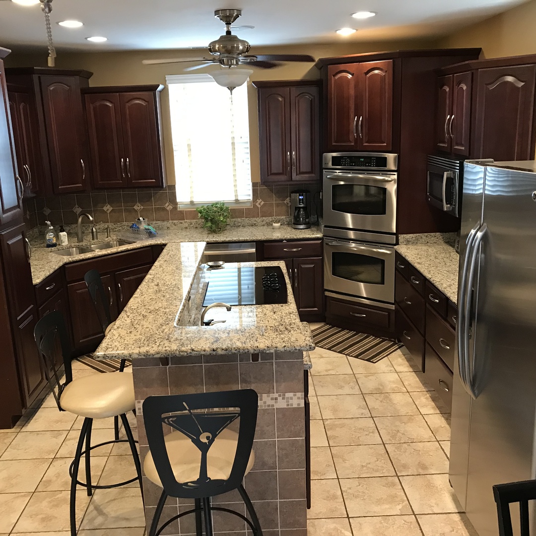 3110 South Racine Avenue Chicago, IL 60608 - Photo 8 of 23 a kitchen with a stove a sink and a refrigerator