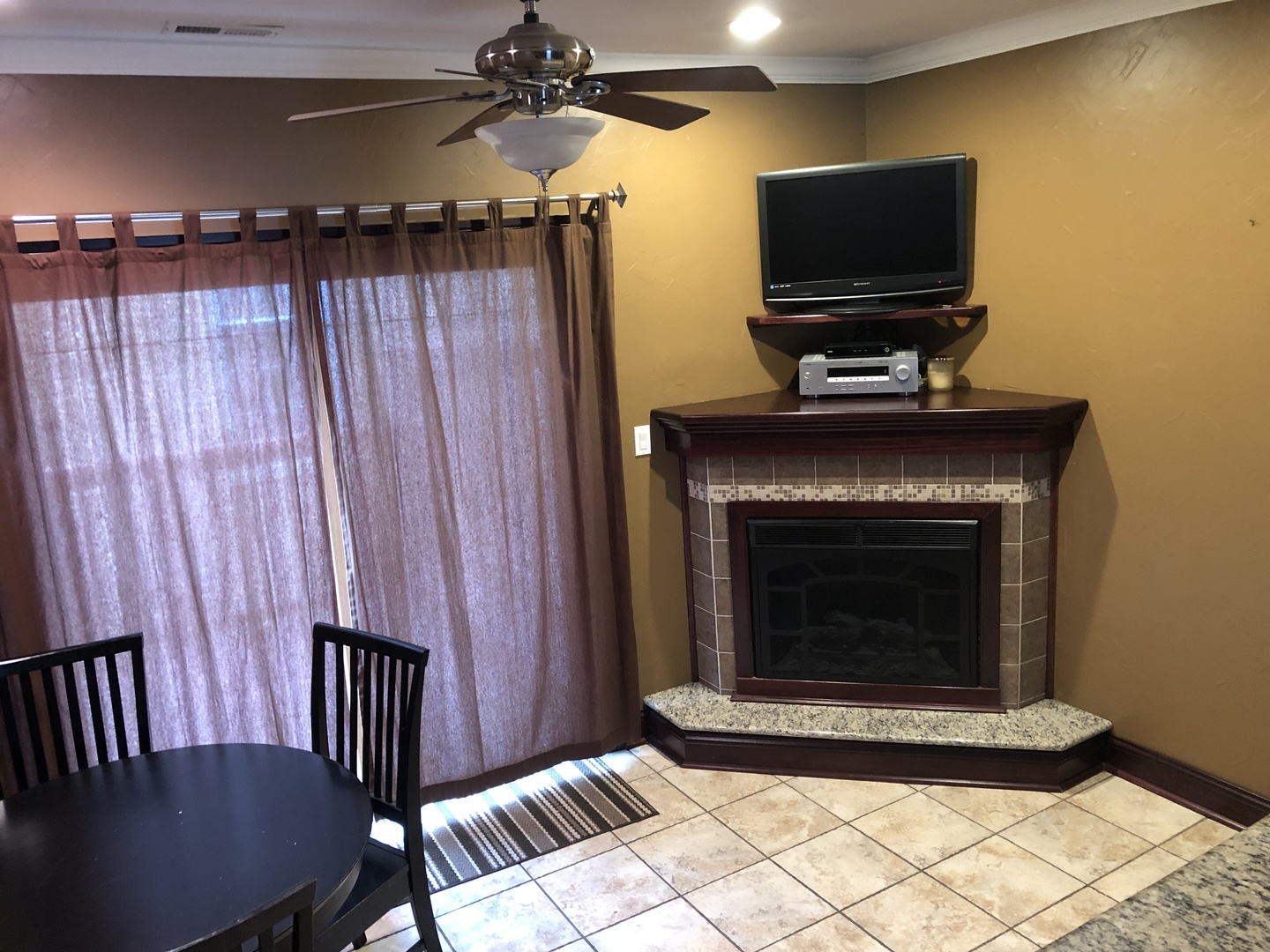 3110 South Racine Avenue Chicago, IL 60608 - Photo 9 of 23 a living room with furniture a flat screen tv and a fireplace