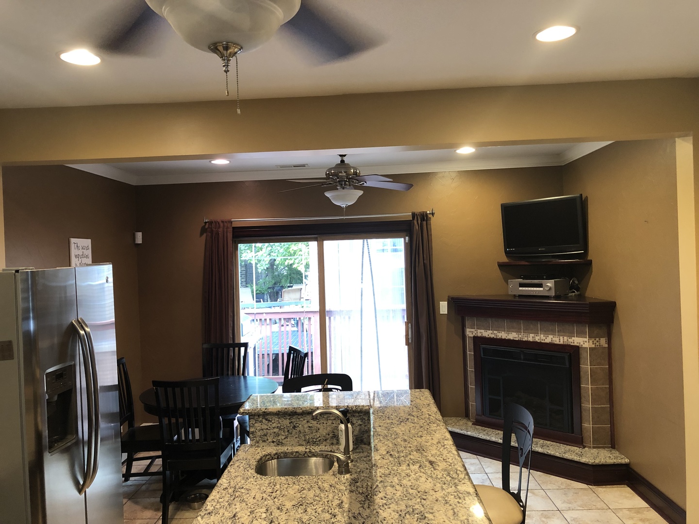 3110 South Racine Avenue Chicago, IL 60608 - Photo 10 of 23 a living room with furniture a flat screen tv and a fireplace