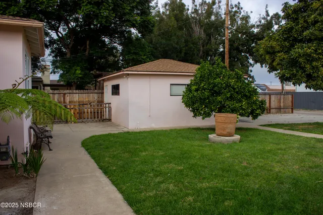 a house view with a garden space