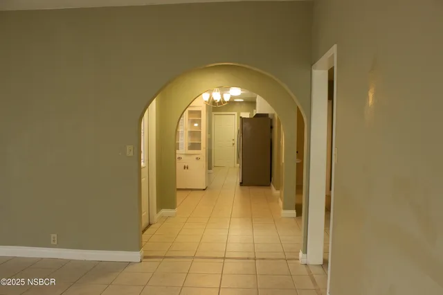 a view of a bathroom with a sink and mirror