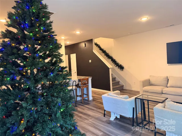 a balcony with furniture and a potted plant