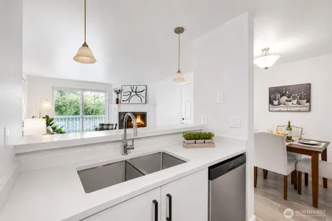 a kitchen with a sink and a window