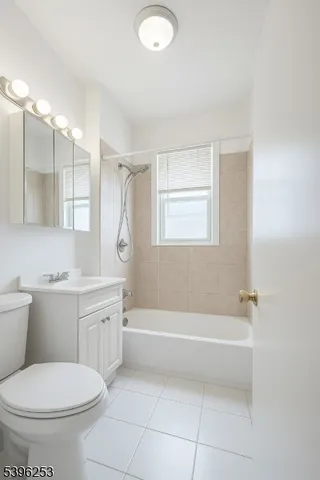 a bathroom with a toilet sink and bathtub