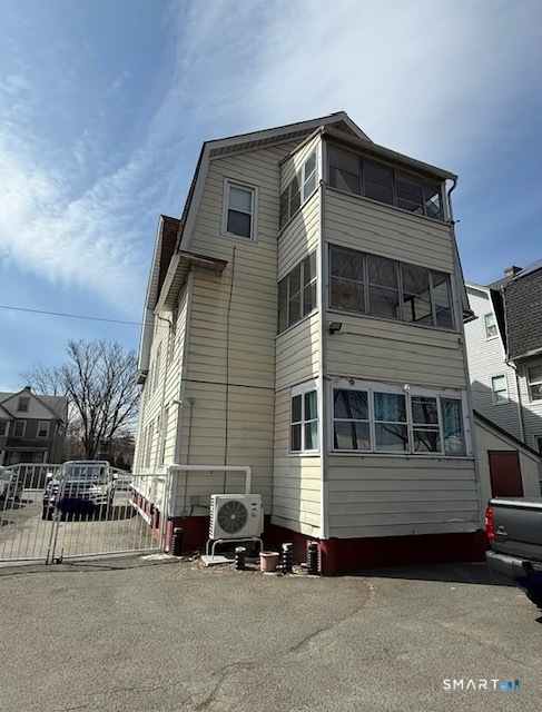1694 Broad Street, Unit 2 Hartford, CT 06106 - Photo 2 of 10 a front view of a house with a parking space
