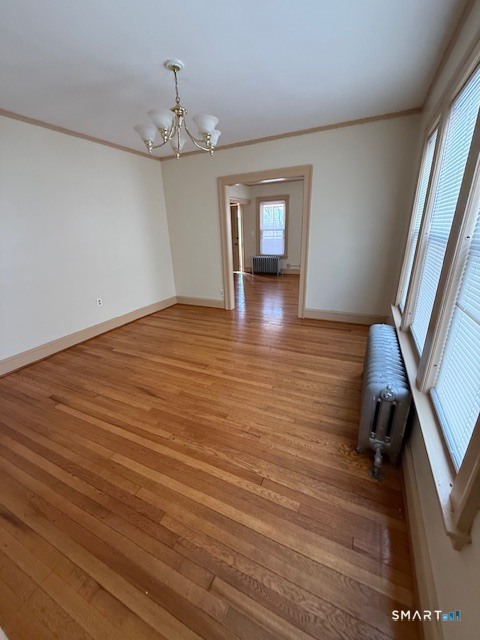 1694 Broad Street, Unit 2 Hartford, CT 06106 - Photo 7 of 10 wooden floor in an empty room with a window