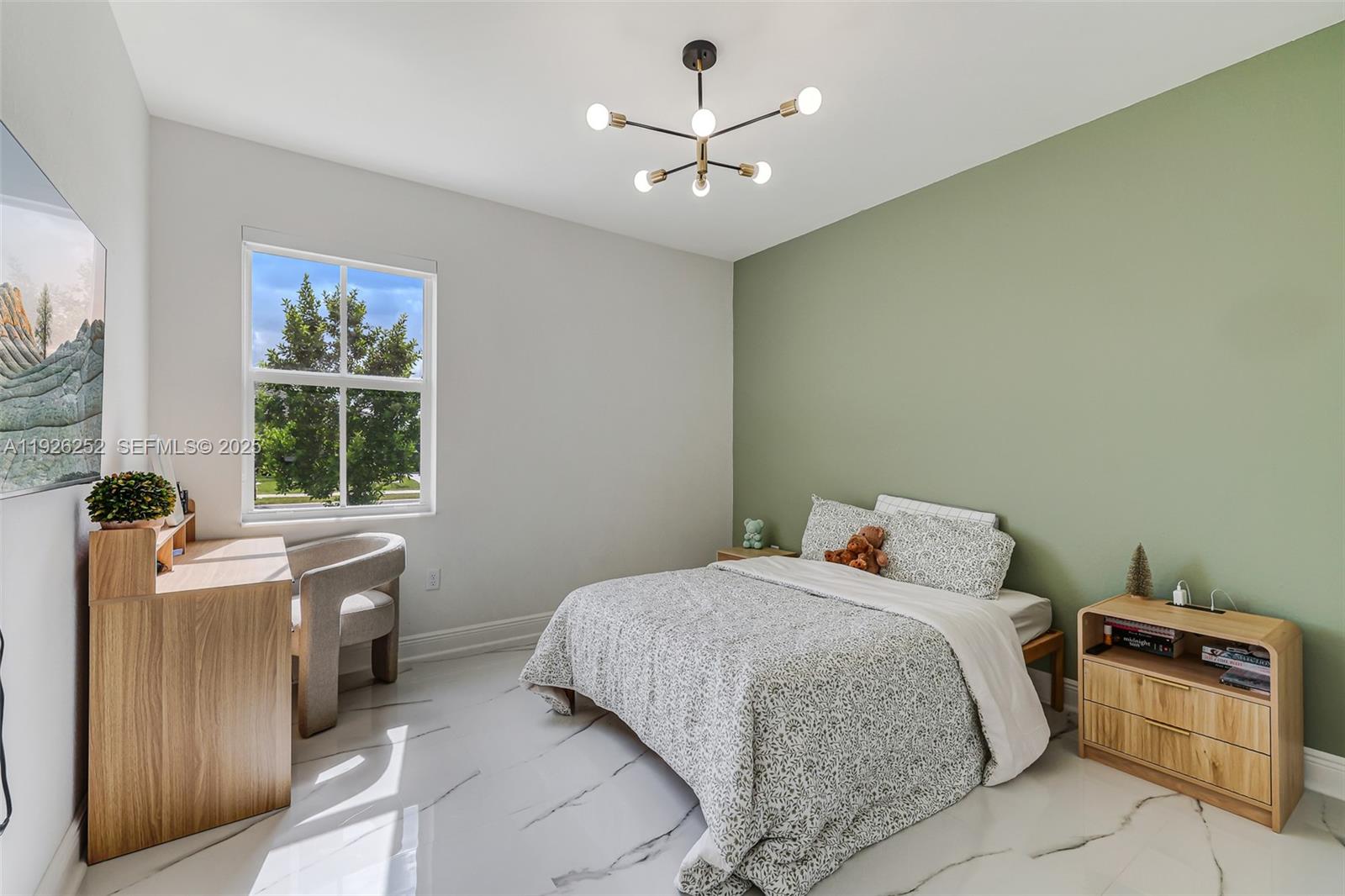 16753 Southwest 290th Street Homestead, FL 33030 - Photo 14 of 29 a bedroom with a bed and a window