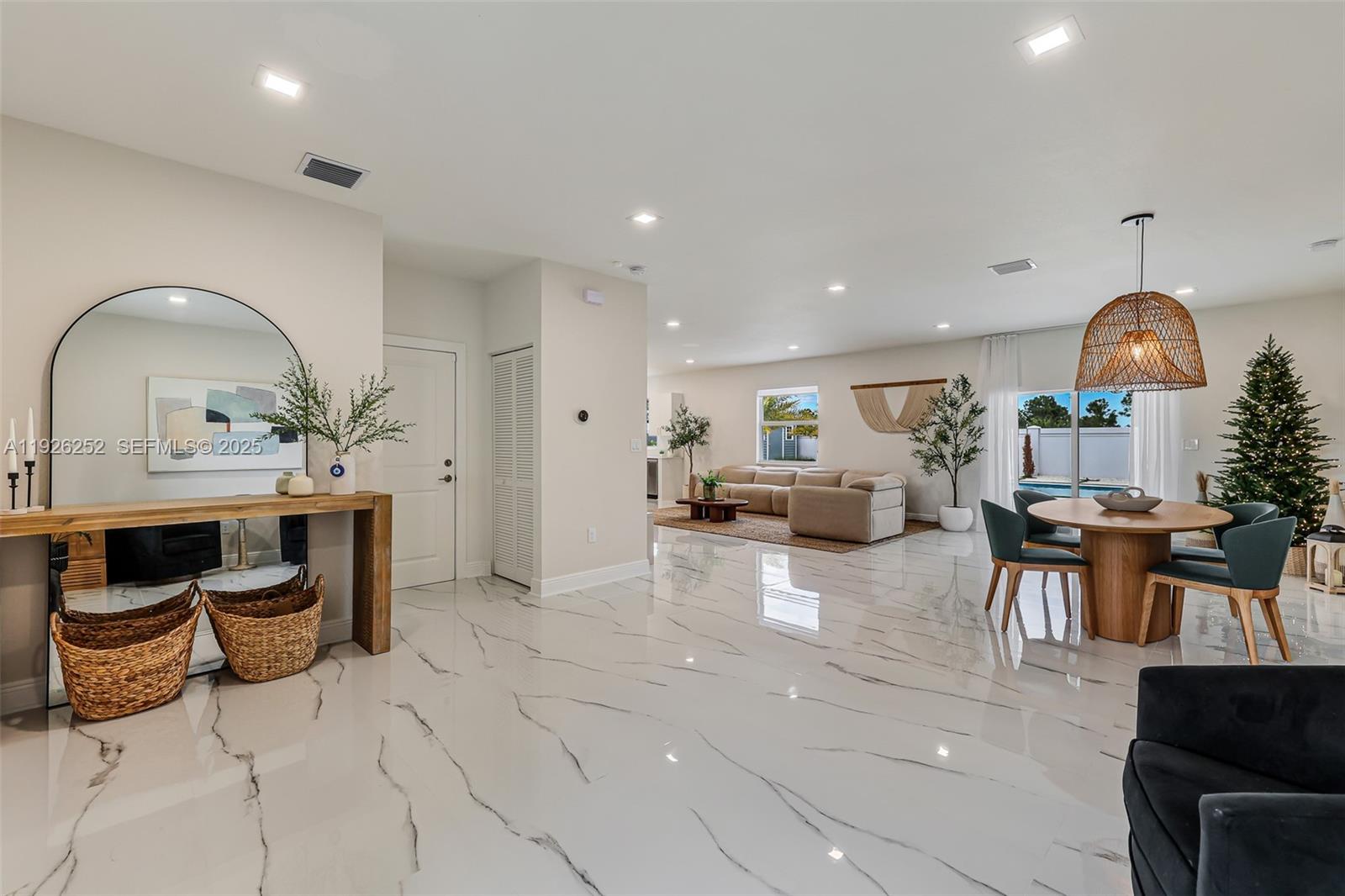 16753 Southwest 290th Street Homestead, FL 33030 - Photo 2 of 29 a living room with furniture and a fireplace