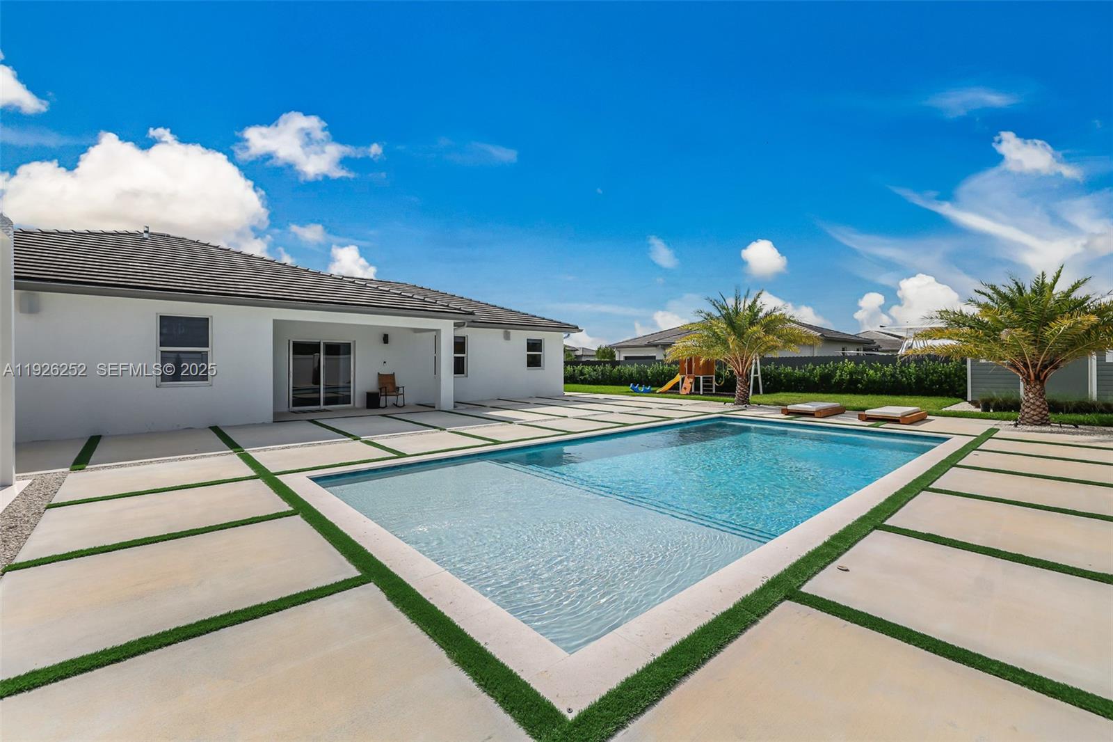 16753 Southwest 290th Street Homestead, FL 33030 - Photo 21 of 29 a view of a house with swimming pool