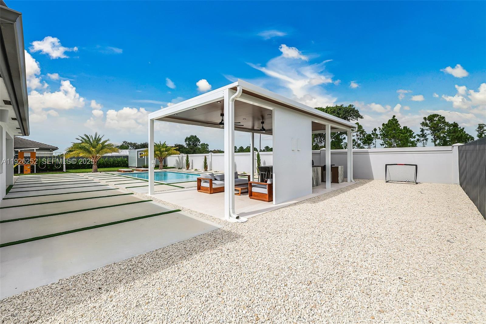 16753 Southwest 290th Street Homestead, FL 33030 - Photo 22 of 29 a view of a terrace with a garden