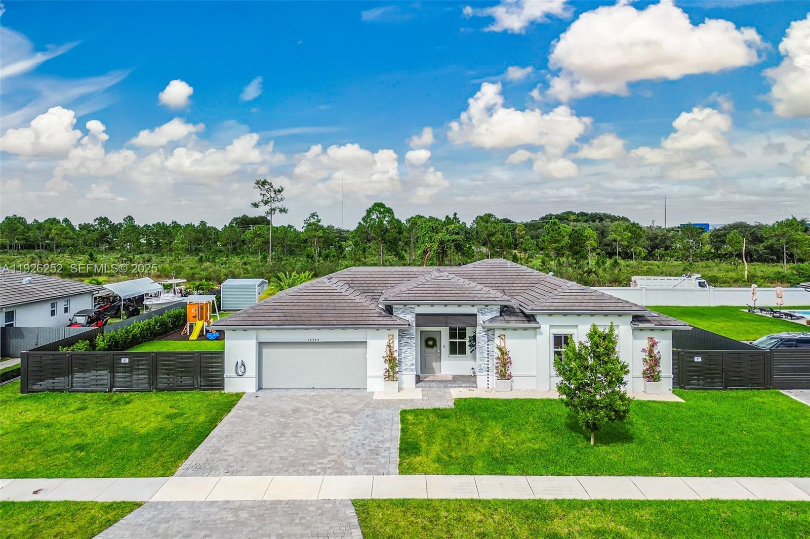 16753 Southwest 290th Street Homestead, FL 33030 - Photo 27 of 29 a aerial view of a house with a big yard