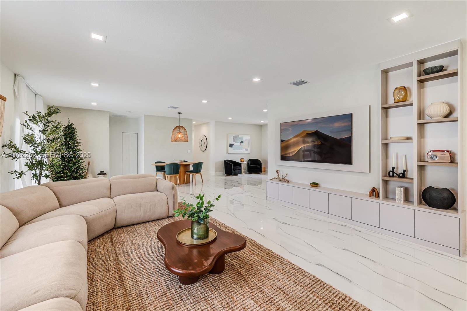 16753 Southwest 290th Street Homestead, FL 33030 - Photo 5 of 29 a living room with furniture and a flat screen tv