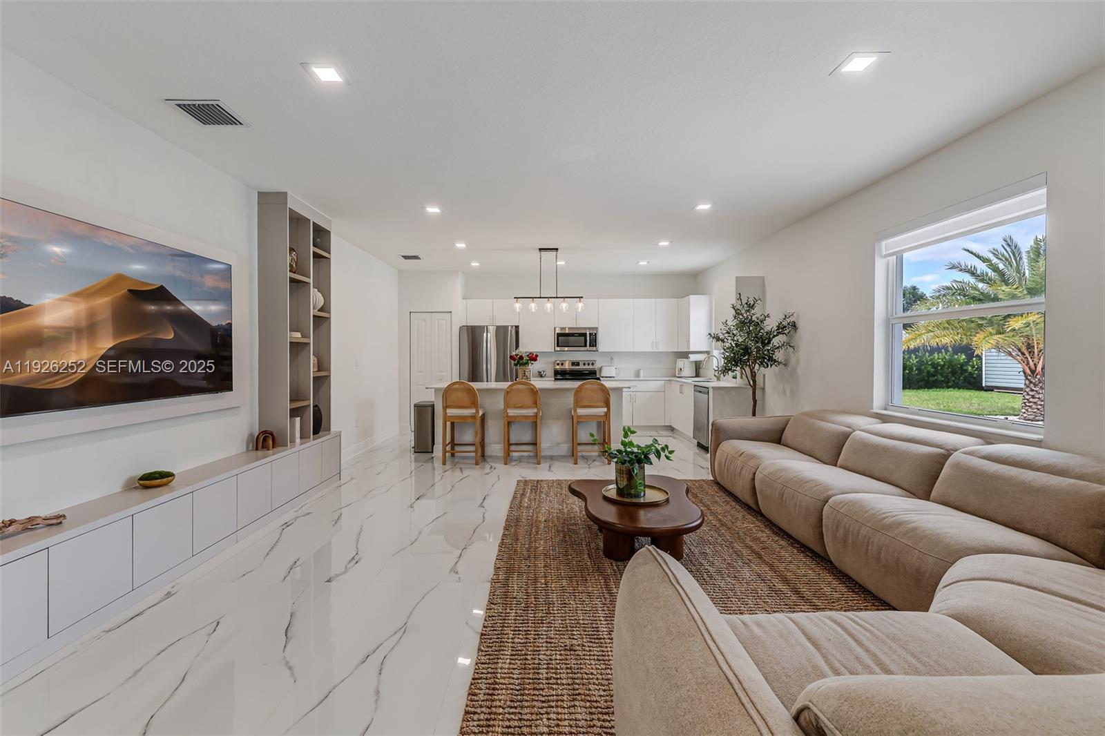 16753 Southwest 290th Street Homestead, FL 33030 - Photo 6 of 29 a living room with furniture and a flat screen tv