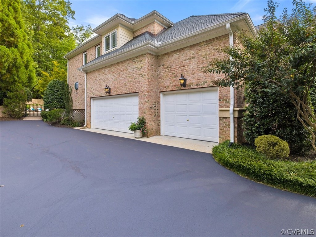 14207 Lander Road Midlothian, VA 23113 - Photo 21 of 21 Plenty of parking and an oversized 2 1/2 car garage. Outdoor lighting and brick exterior on four sides. Driveway just sealed!