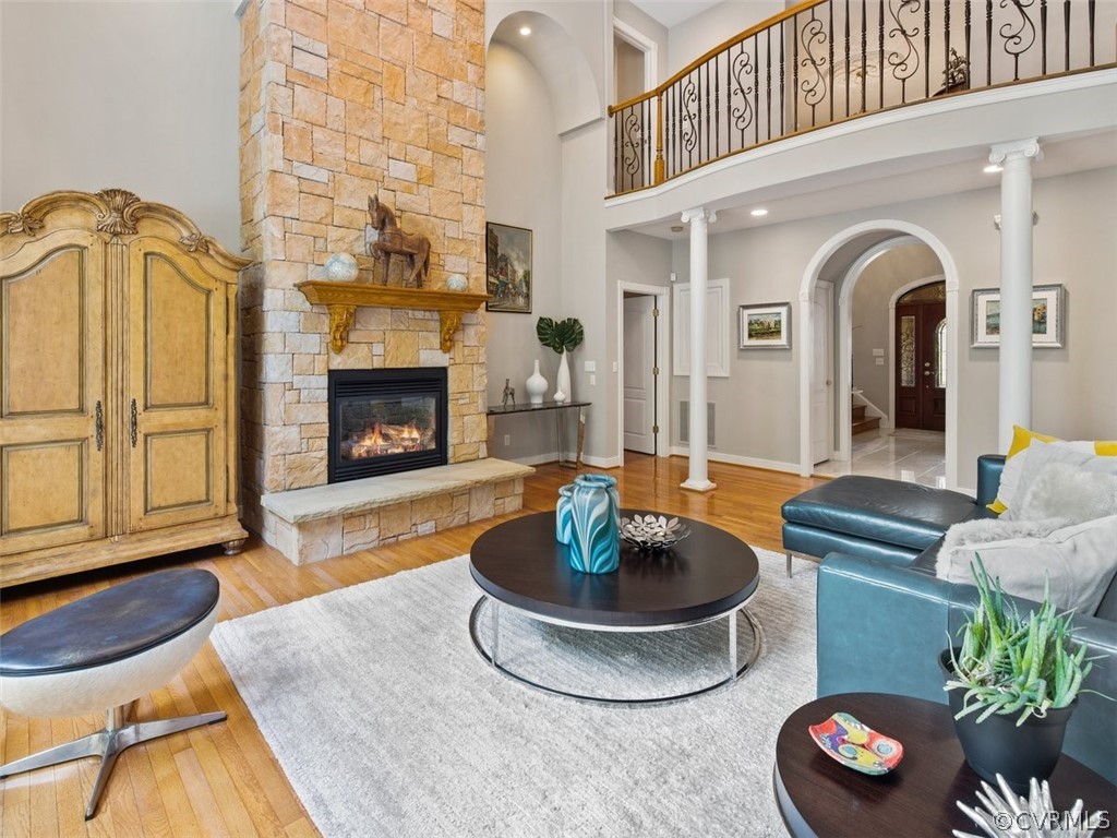 14207 Lander Road Midlothian, VA 23113 - Photo 6 of 21 Another view of the family room showing the arched opening into the foyer. Don't miss the custom railings on the second level. Dual staircases. The second stairway is in the rear with easy access to the kitchen.