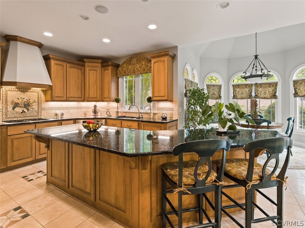 14207 Lander Road Midlothian, VA 23113 - Photo 7 of 21 Large center island with seating & storage. Opens to breakfast area. Custom cabinets and tile.