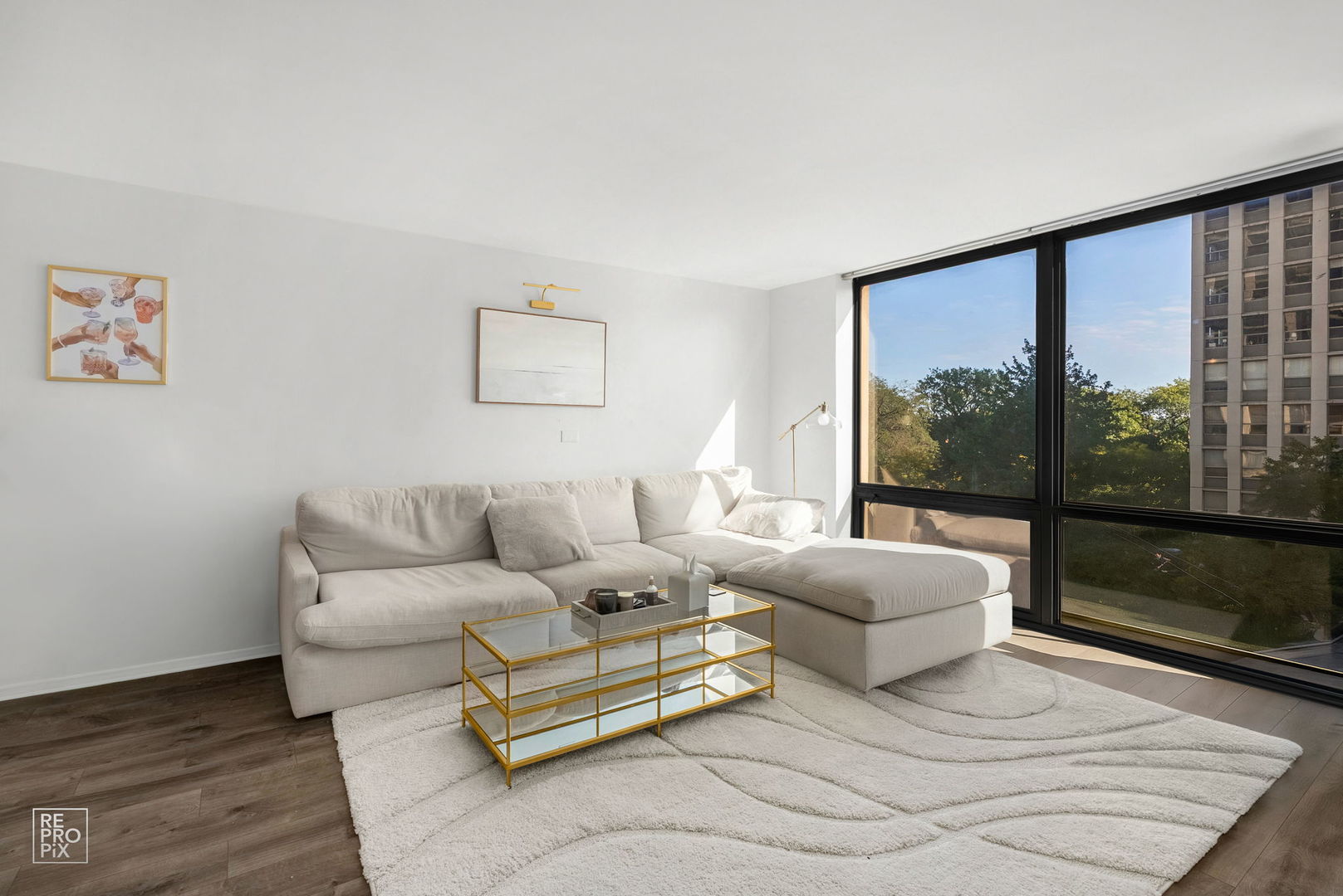 2650 North Lakeview Avenue, Unit 404 Chicago, IL 60614 - Photo 2 of 13 a living room with furniture and a large window