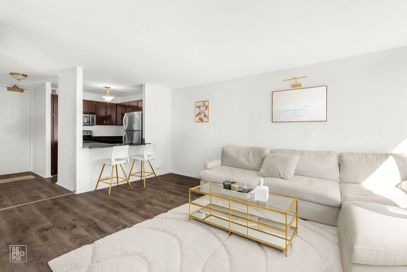 2650 North Lakeview Avenue, Unit 404 Chicago, IL 60614 - Photo 3 of 13 a living room with furniture and kitchen view