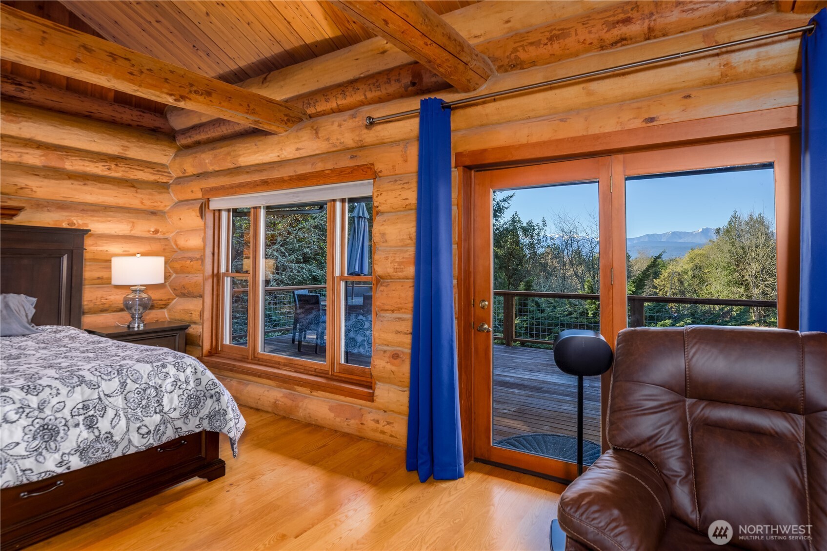193 Snowberry Lane Sequim, WA 98382 - Photo 14 of 40 a bedroom with a large bed and a large window with outer view