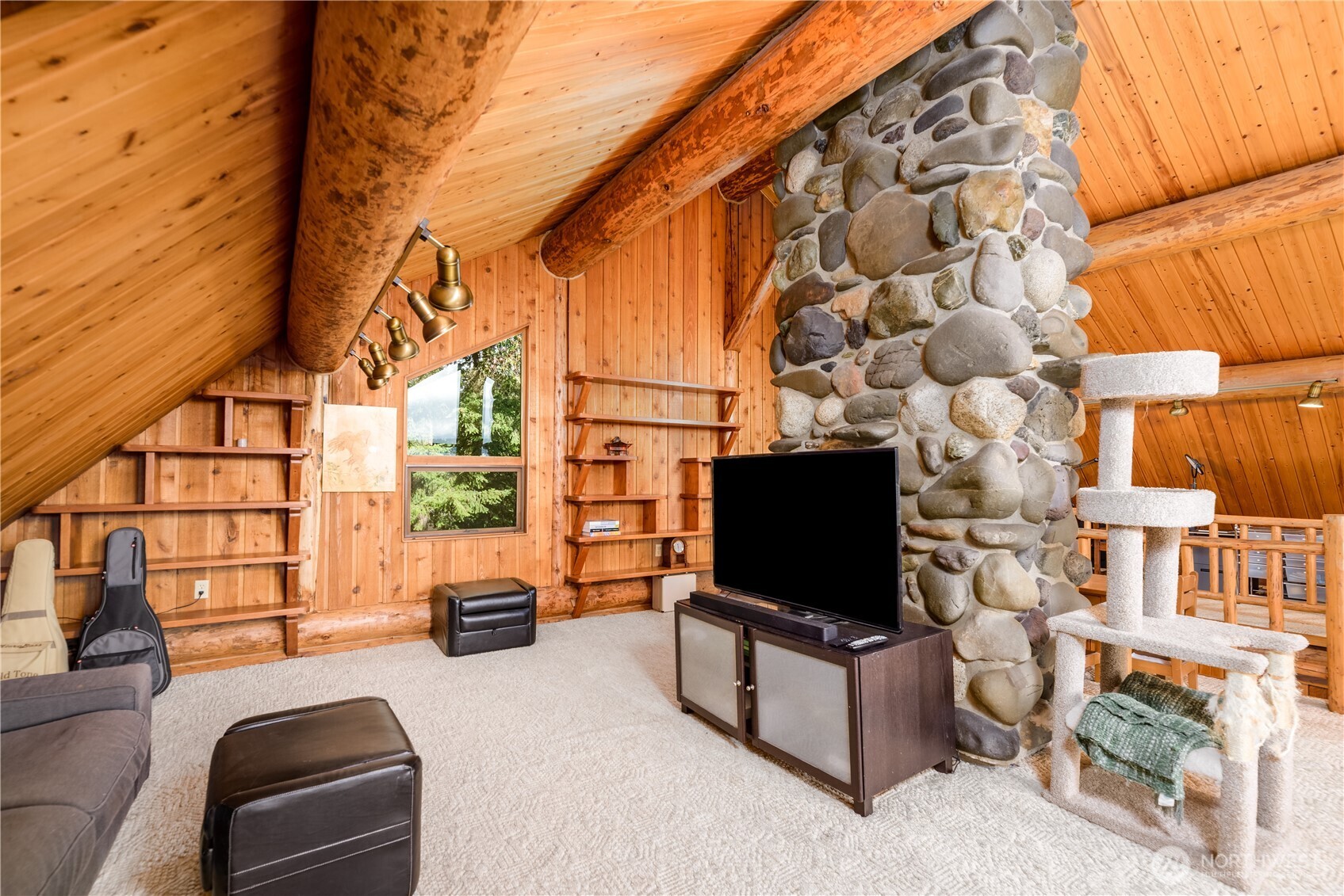 193 Snowberry Lane Sequim, WA 98382 - Photo 23 of 40 a living room with couch and a flat screen tv