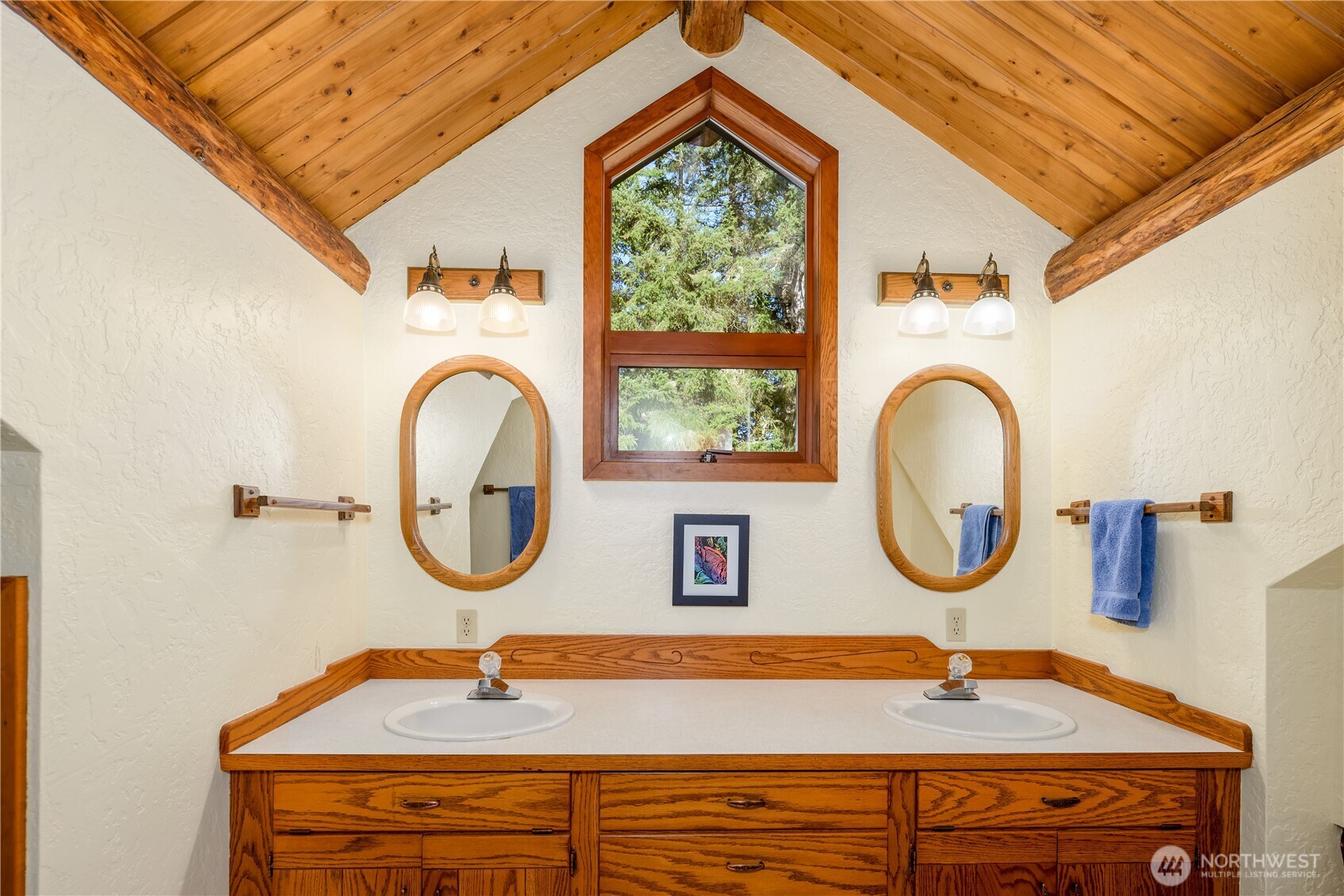 193 Snowberry Lane Sequim, WA 98382 - Photo 25 of 40 a bathroom with a sink and a mirror