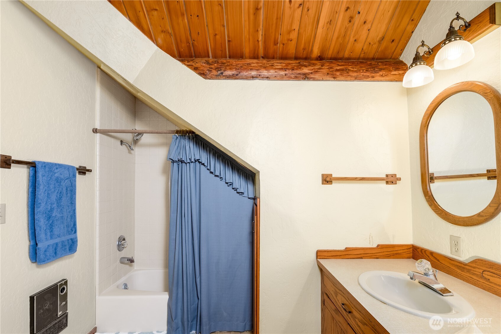193 Snowberry Lane Sequim, WA 98382 - Photo 26 of 40 a bathroom with a sink a mirror and a shower